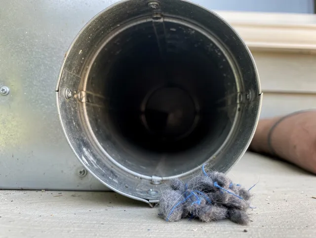 Storrs Dryer Vent Cleaning technician using specialized equipment to clear severe dryer vent blockage in Storrs